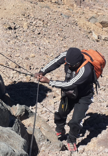 Man hiking at Mount Kenya near Comfort Gardens Nanyuki