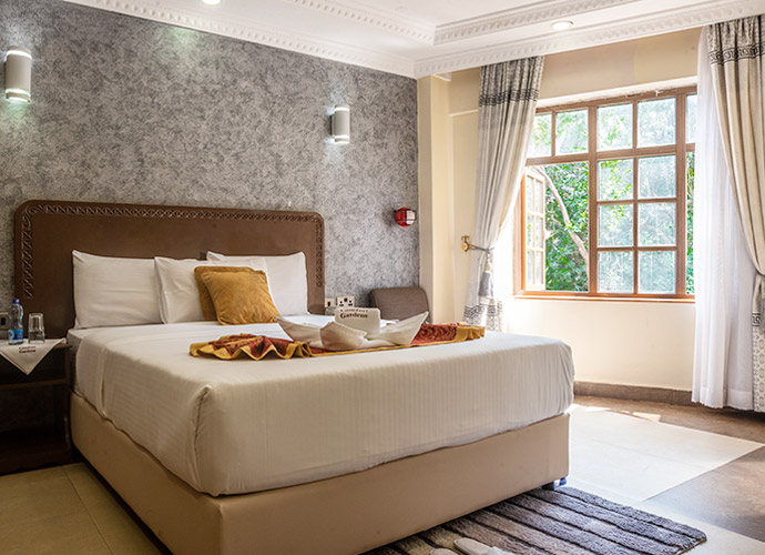 Interior view of a guest room at Comfort Gardens Nairobi